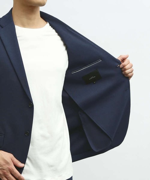 【セットアップ対応/FLEX JACKET】ポンチ シャンブレー ジャケット モデル：H178 B82 W76 H88 着用サイズ：48ネイビー