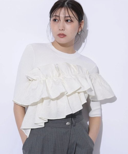 5分袖アシメフリルニット 予めご了承ください