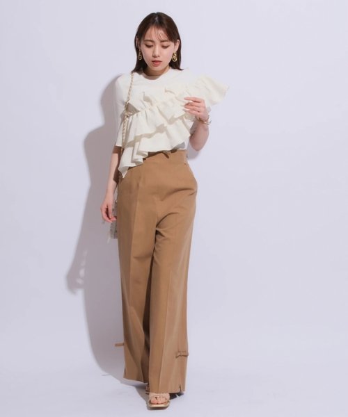 5分袖アシメフリルニット 予めご了承ください