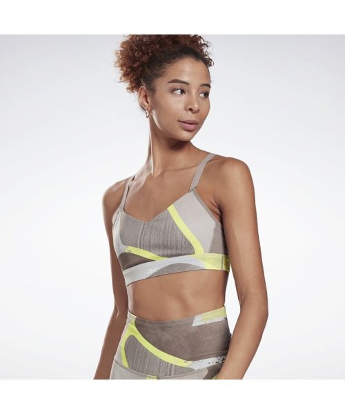 Reebok(リーボック)/Lux ストラッピー スポーツブラ / Lux Strappy Sports Bra/イエロー