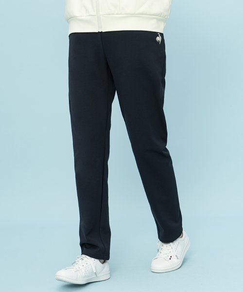 le coq sportif (ルコックスポルティフ)/ヘランカ防風ツイルジャージ AIR STYLISH PANTS  L‘oeuf forme/ネイビー