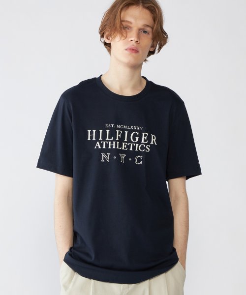 TOMMY HILFIGER(トミーヒルフィガー)/ヒルフィガースタックロゴTシャツ/ネイビー 